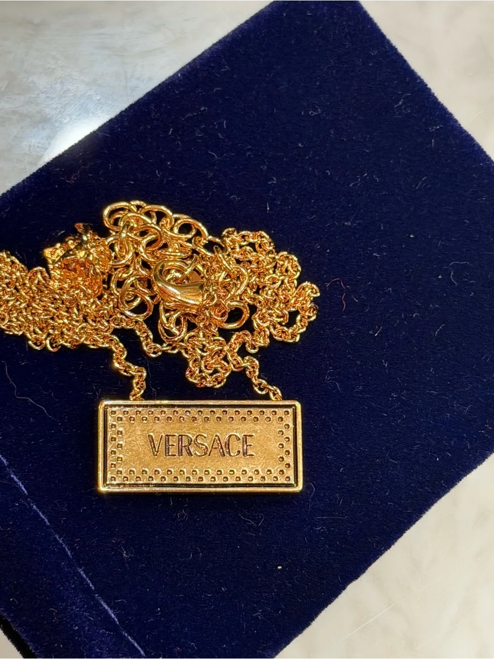 Versace Gold Logo Bar Necklace with Pink Floral Accent